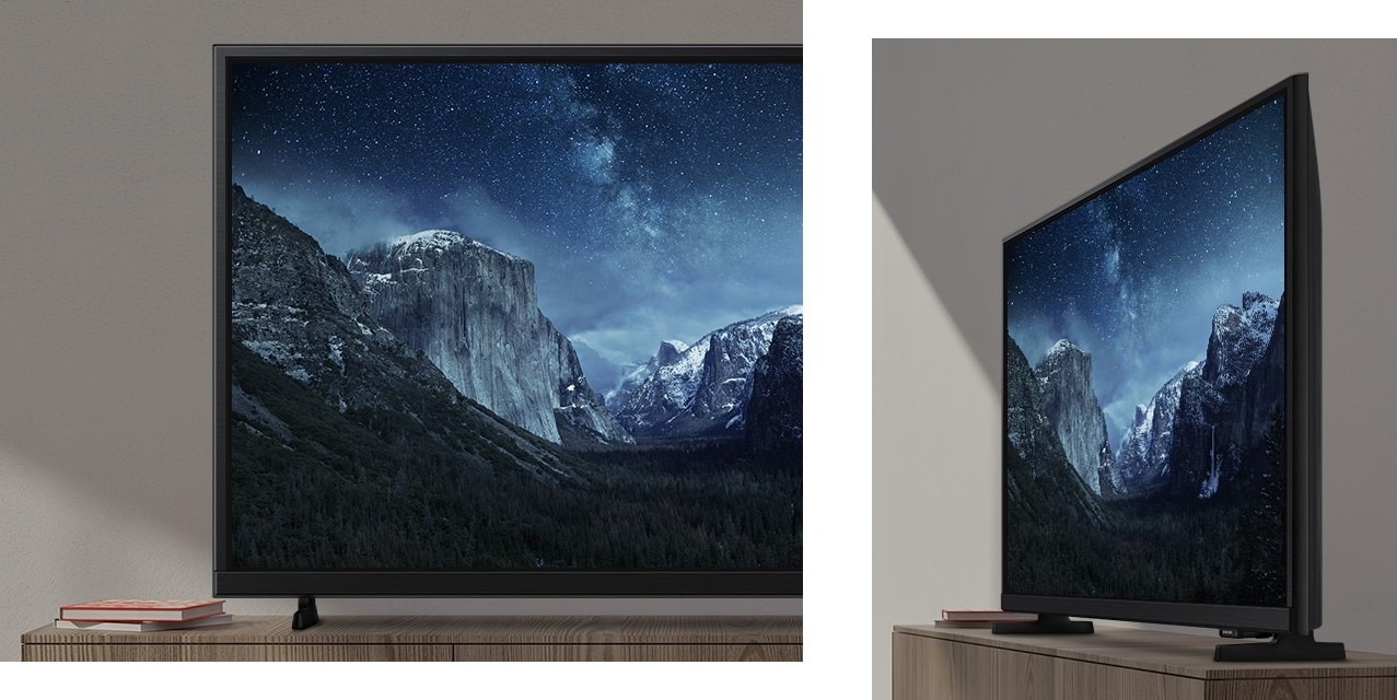 Изображение на дисплее телевизора выглядит резким и ярким, демонстрируя детализированный ночной пейзаж с улучшенной четкостью и контрастностью цветов.